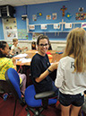 %_tempFileNameteignmouth-campus-staff-with-kid-in-playschool%