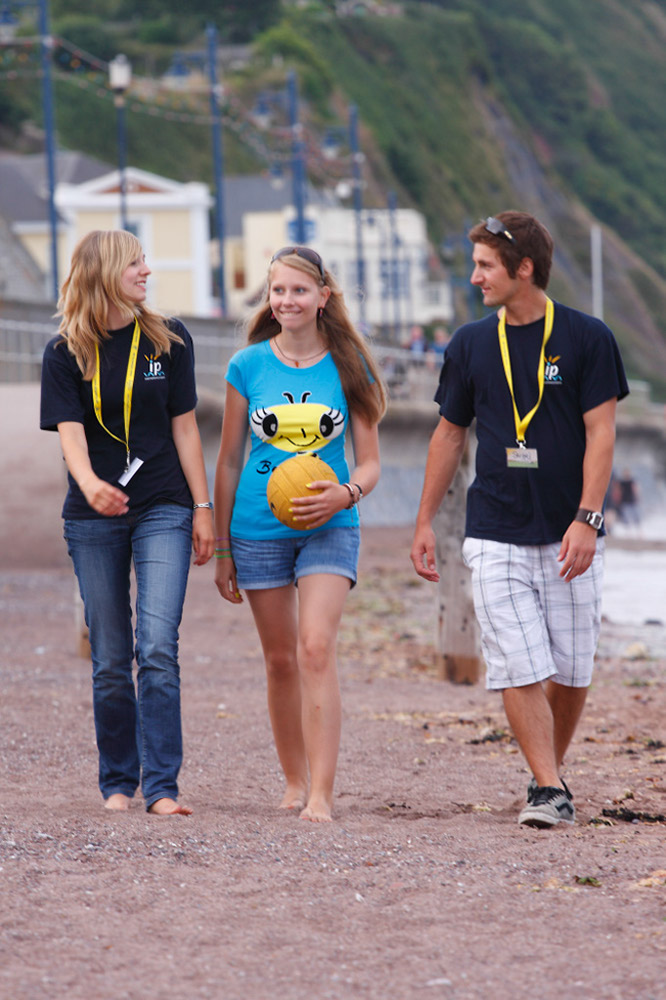 %_tempFileNamegirl-with-staff-at-the-beach-1%
