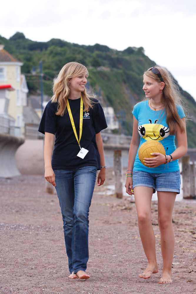 %_tempFileNamegirl-with-staff-at-the-beach-11%