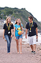 %_tempFileNamegirl-with-staff-at-the-beach-8%