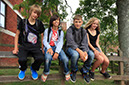 %_tempFileNamestudents-sitting-on-bannister-7%