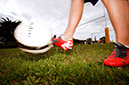 %_tempFileNamefeet-hitting-football%
